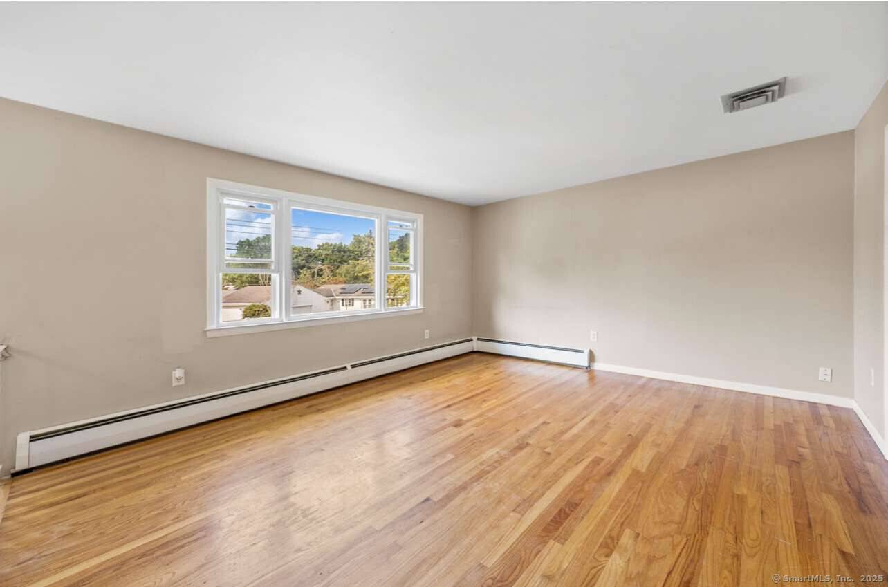 Discover this charming raised ranch tucked away on a quiet cul de sac in the sought after Morris Cove neighborhood.