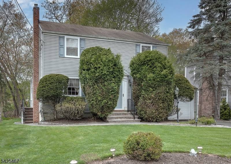Fabulous well maintained Colonial behind Harrison elementary school.