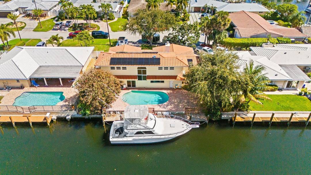 80 feet of deep water frontage, no fixed bridges, and just around the corner from Hillsboro Inlet, a boater's DREAM.
