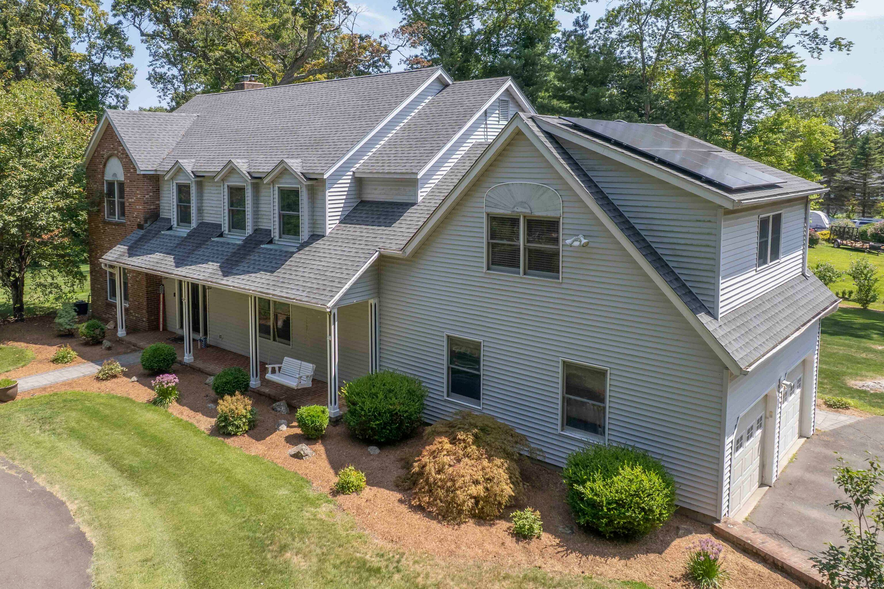 Welcome home ! This large colonial style home features 4 bedrooms, 2.