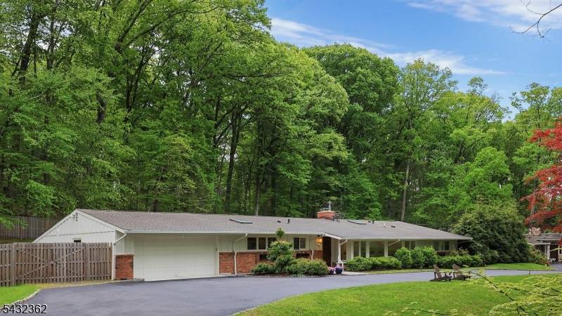 A true Mid Century Modern 1950's stunner, this sun drenched home blends timeless design with modern comfort.