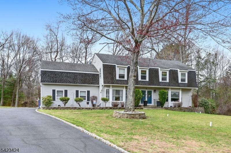 Stunning 4 bed 2. 5 bath classic Colonial is beautifully set on nearly three quarters of an acre in desirable Oak Ridge.