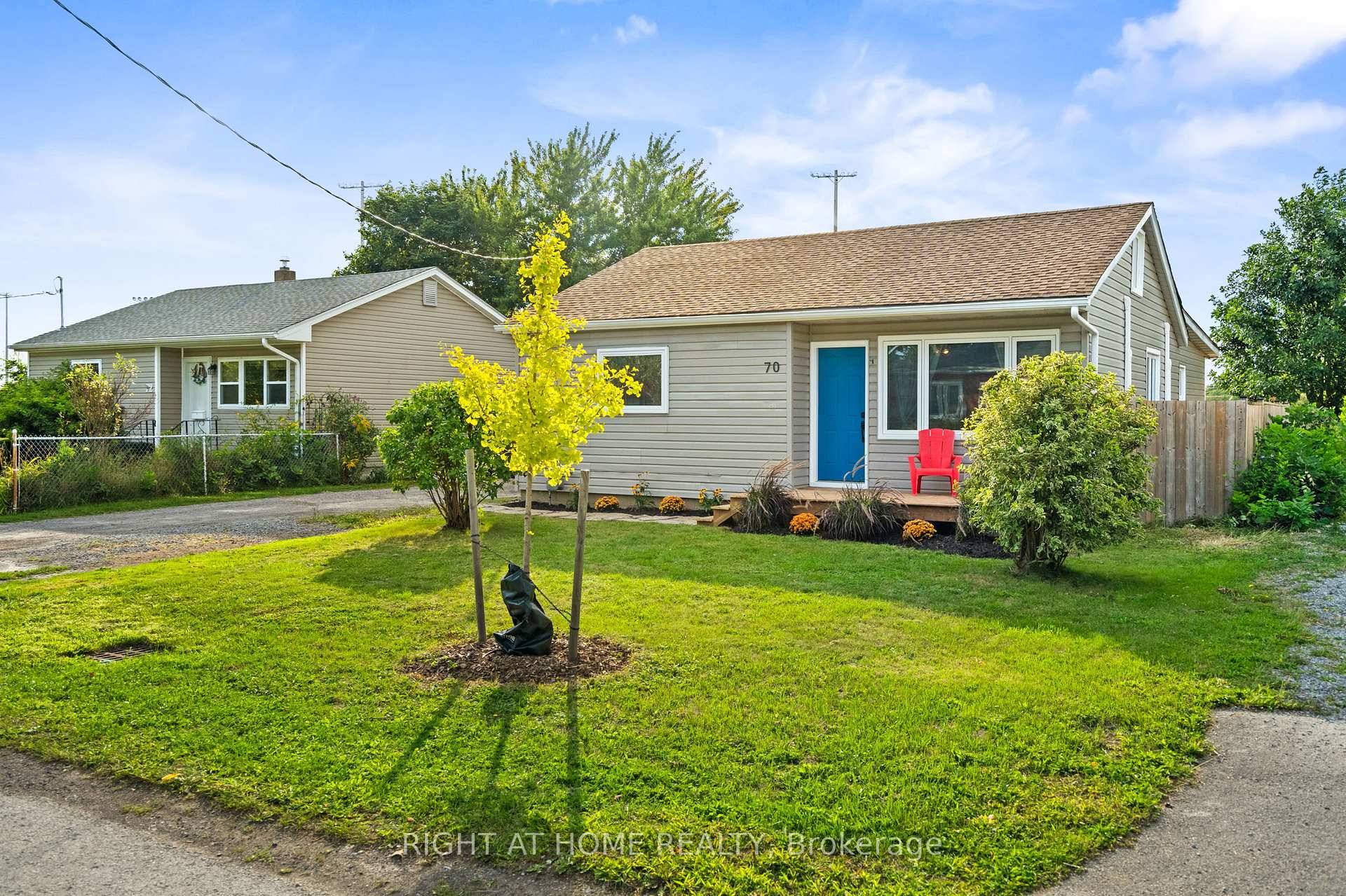 Charming and move in ready bungalow with 3 bedrooms, a full 4 piece bath, and a convenient half bath ensuite off the primary.