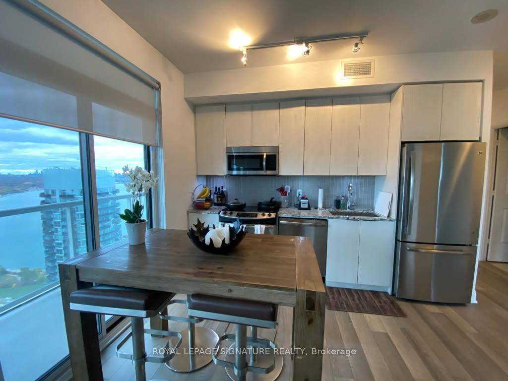 Step into elevated living at Lago at the Waterfront, where this spacious corner suite offers uninterrupted water and skyline views from every room.
