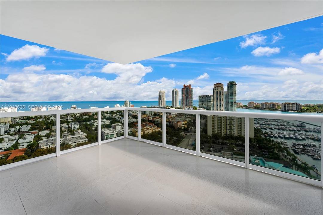 Panoramic water and skyline views define this rare corner residence at Murano Grande, where floor to ceiling glass fills the home with natural light and showcases Biscayne Bay, the Atlantic ...