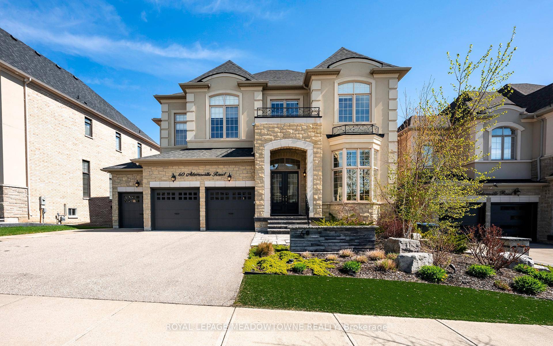 This exceptional luxury home backing onto a ravine in prestigious Credit Ridge is a must see !