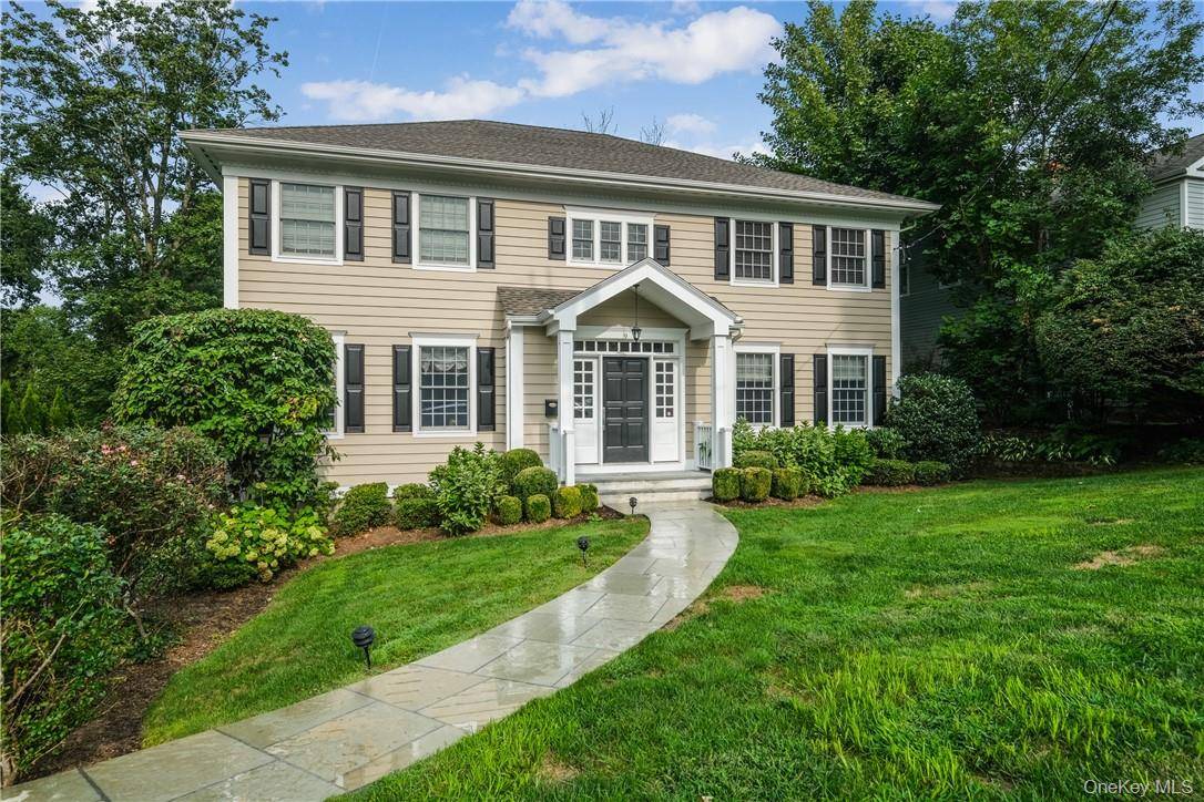 Welcome this young sun filled center hall Colonial set on a third of an acre in the highly desirable Greenacres neighborhood.