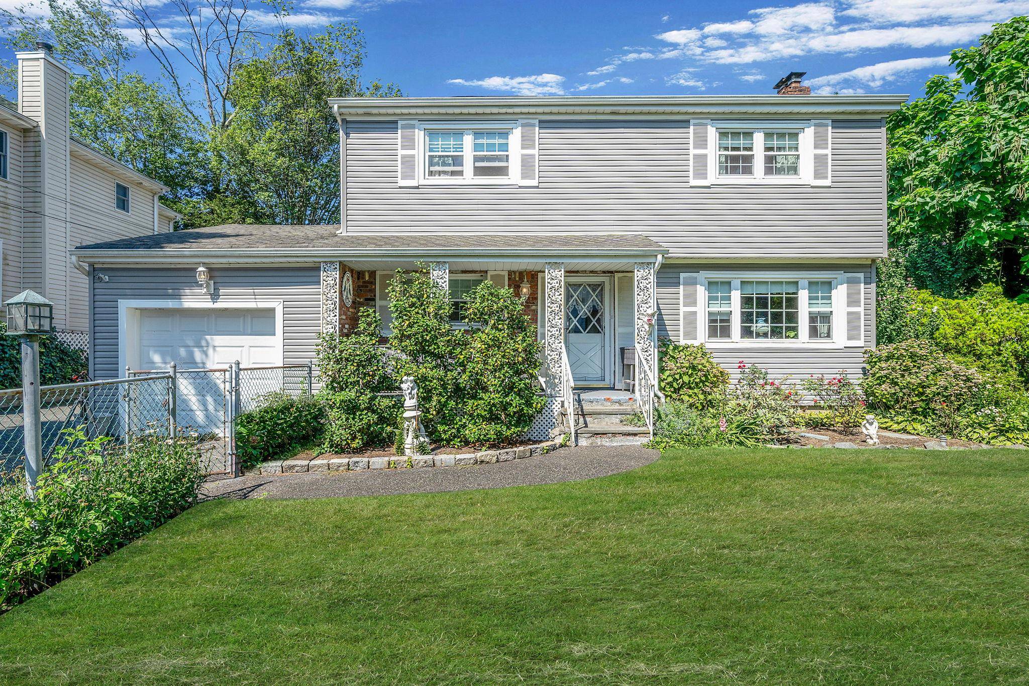 Location ! Location ! Welcome to this charming sun filled 4 bedroom, 1.