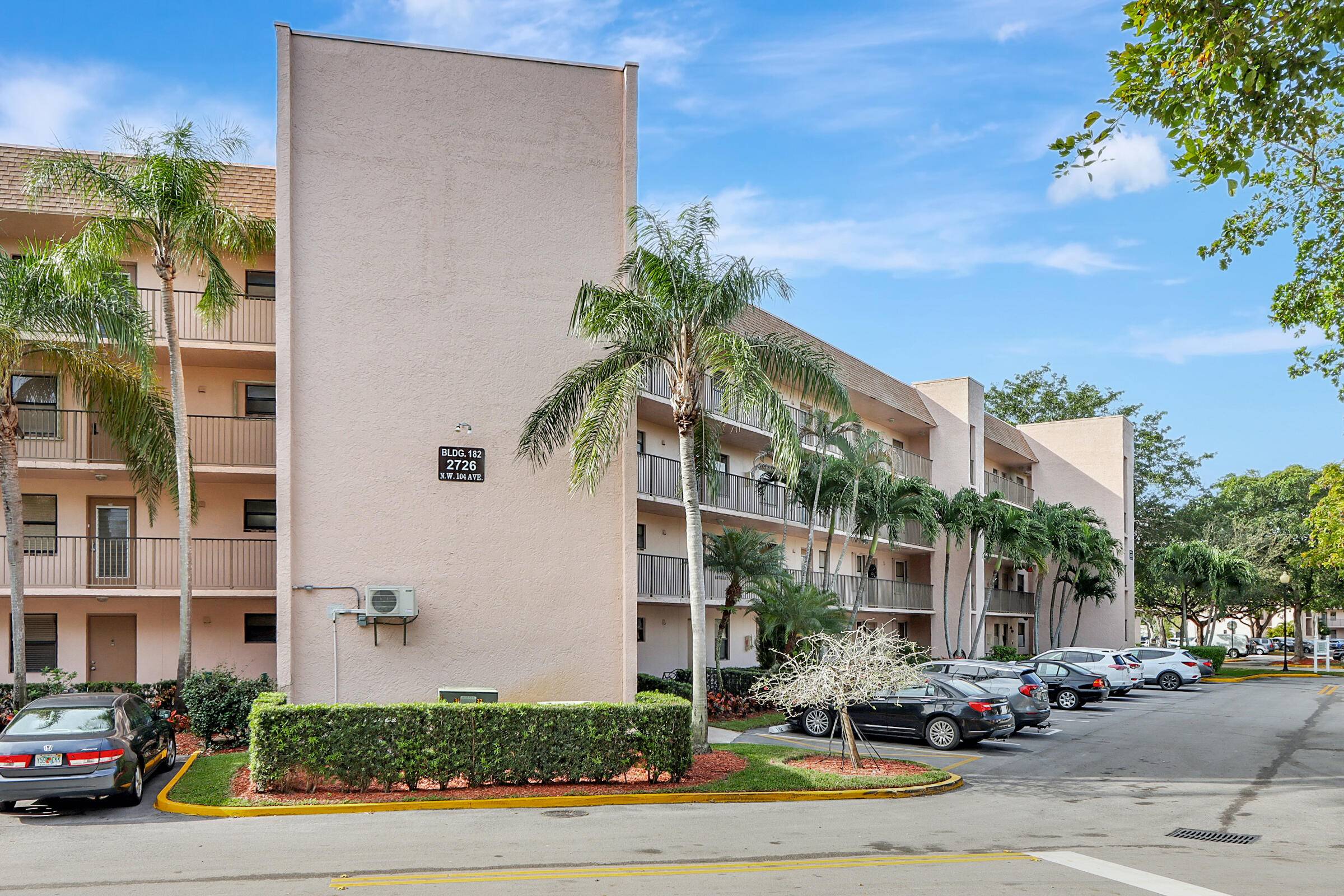 CLASSIC FLORIDA CONDO LIVING, 2 BED 2 BATH 2ND FLOOR CORNER UNIT WITH LAKE VIEW IN SERENE 55 GOLF COMMUNITY.