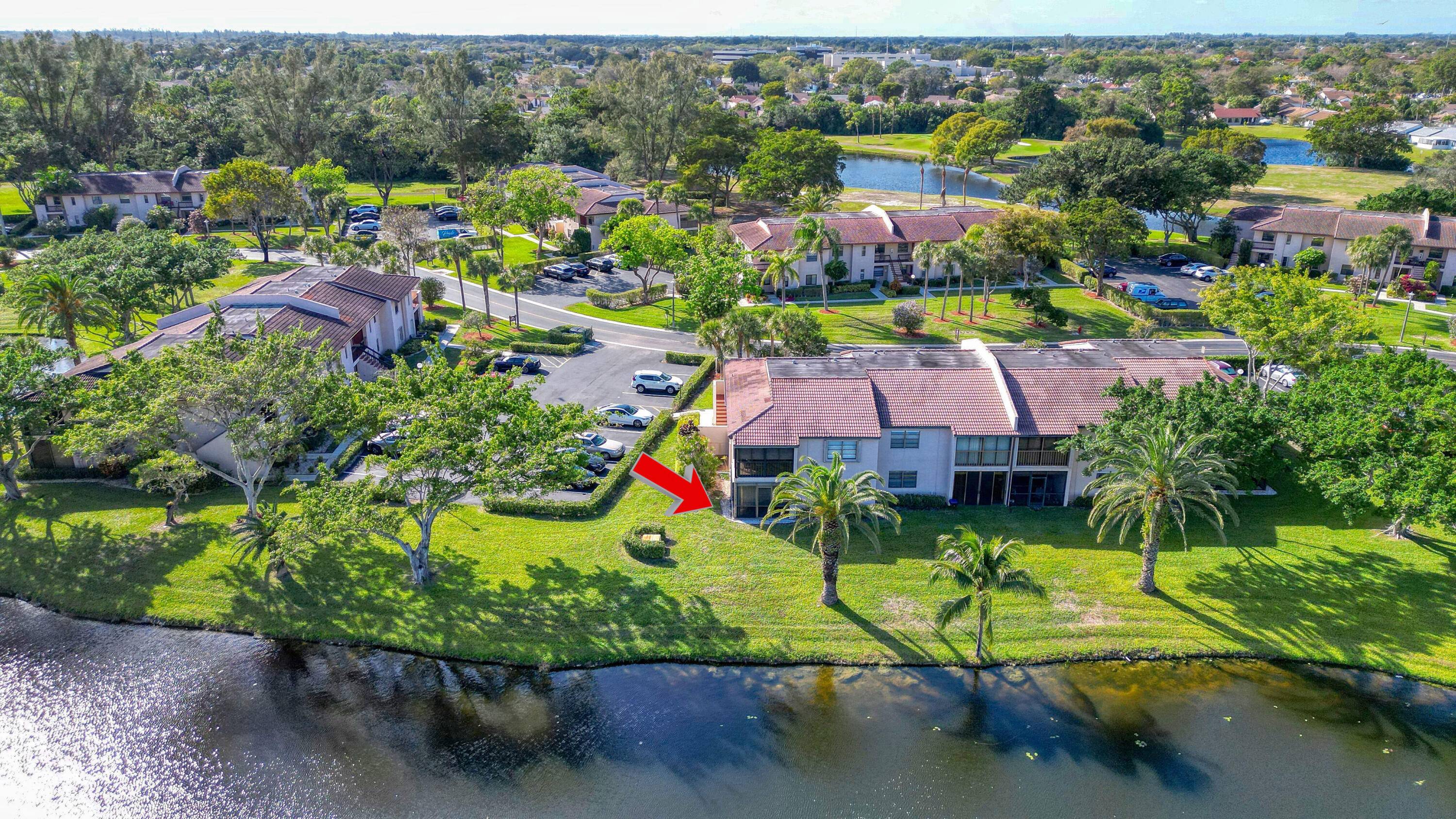 Enjoy stunning lake views from this bright first floor corner unit with a glass enclosed patio.