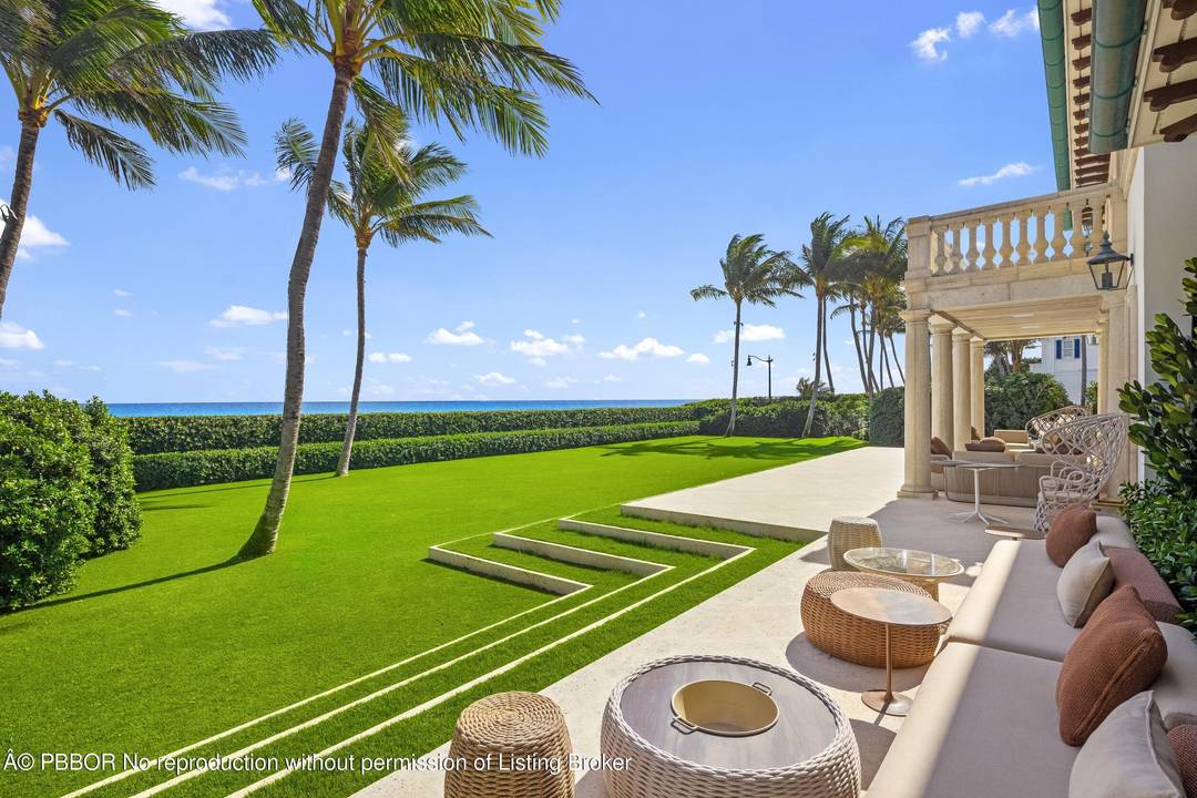 Perched on a rare, extraordinarily high elevation oceanfront parcel which sits as high as 23 feet and spans 3 4 of an acre, this completely renovated Palm Beach estate captures ...