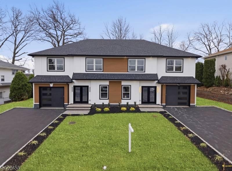 A brand new half duplex thoughtfully designed for modern living, this two story home impresses with a first floor that blends living, dining, and kitchen into an open concept space ...