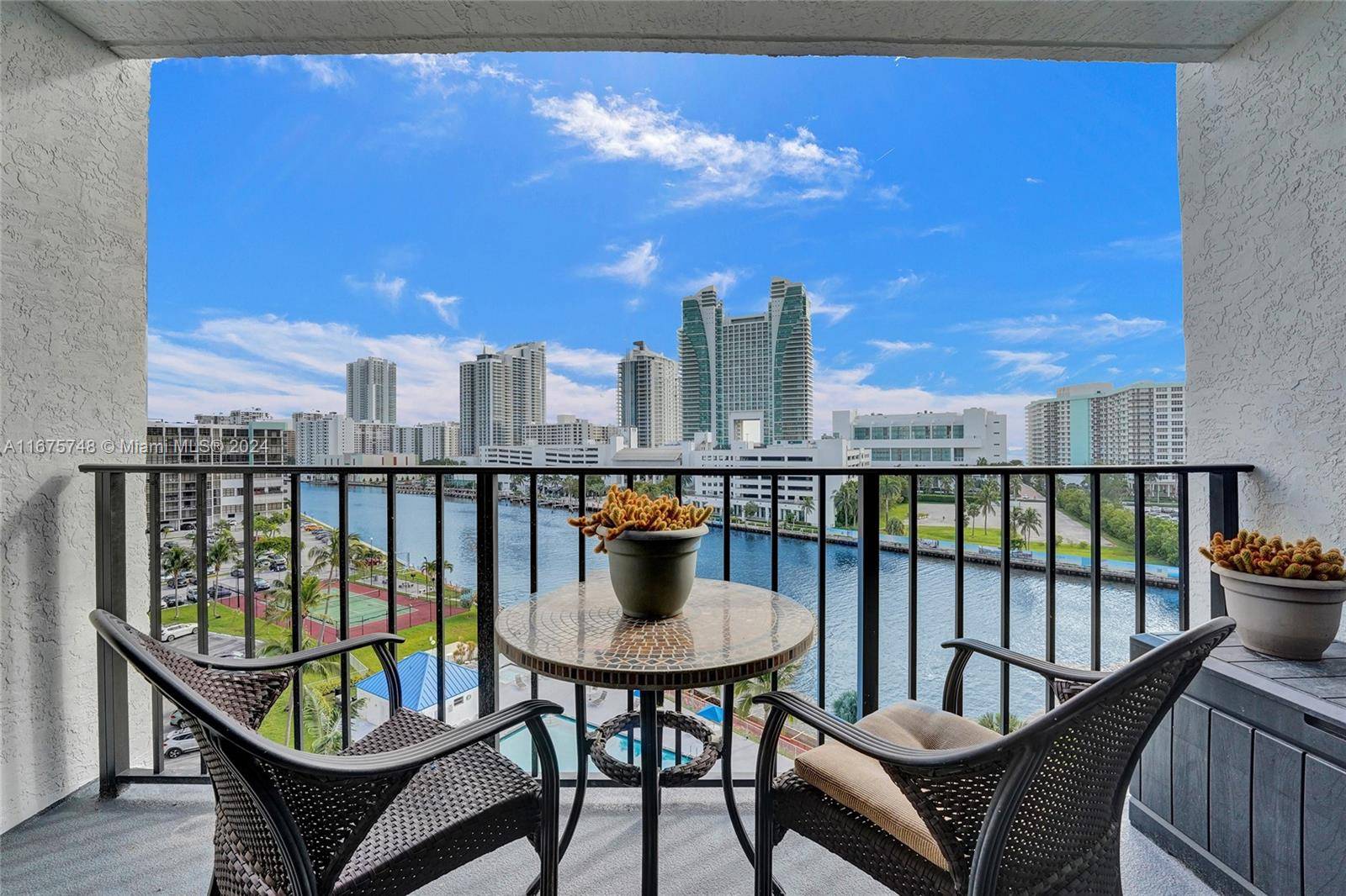 Beautifully renovated direct water view condo has floor to ceiling impact windows doors looking out on the yachts passing by with the ocean in the distance.