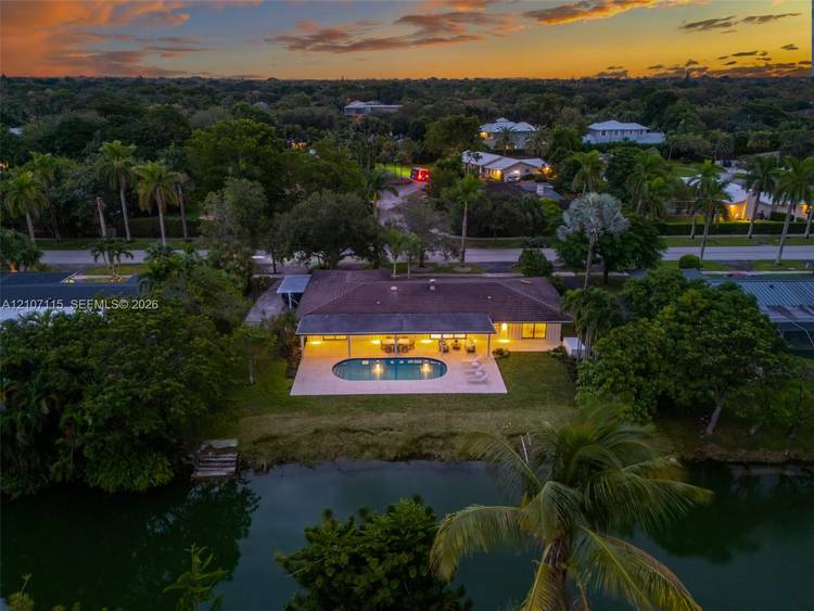 Welcome to this stunning, completely renovated canal front residence in desirable Pinecrest, offering 3, 034 sq ft of refined living with 5 bedrooms, 4 full bathrooms, and an additional powder ...