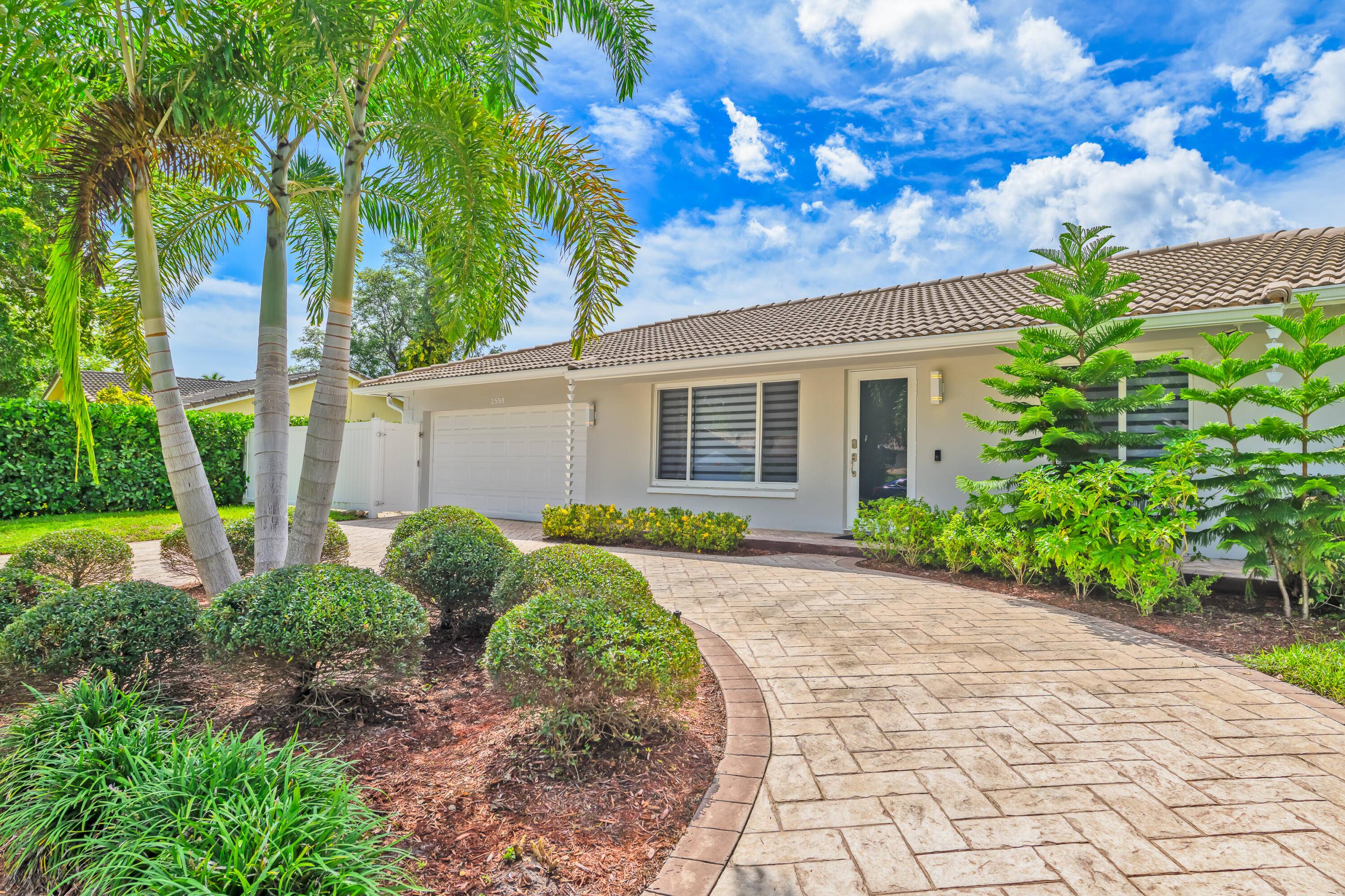 Welcome to this beautifully updated corner lot home with pool in the desirable Boca Madera community along the St.