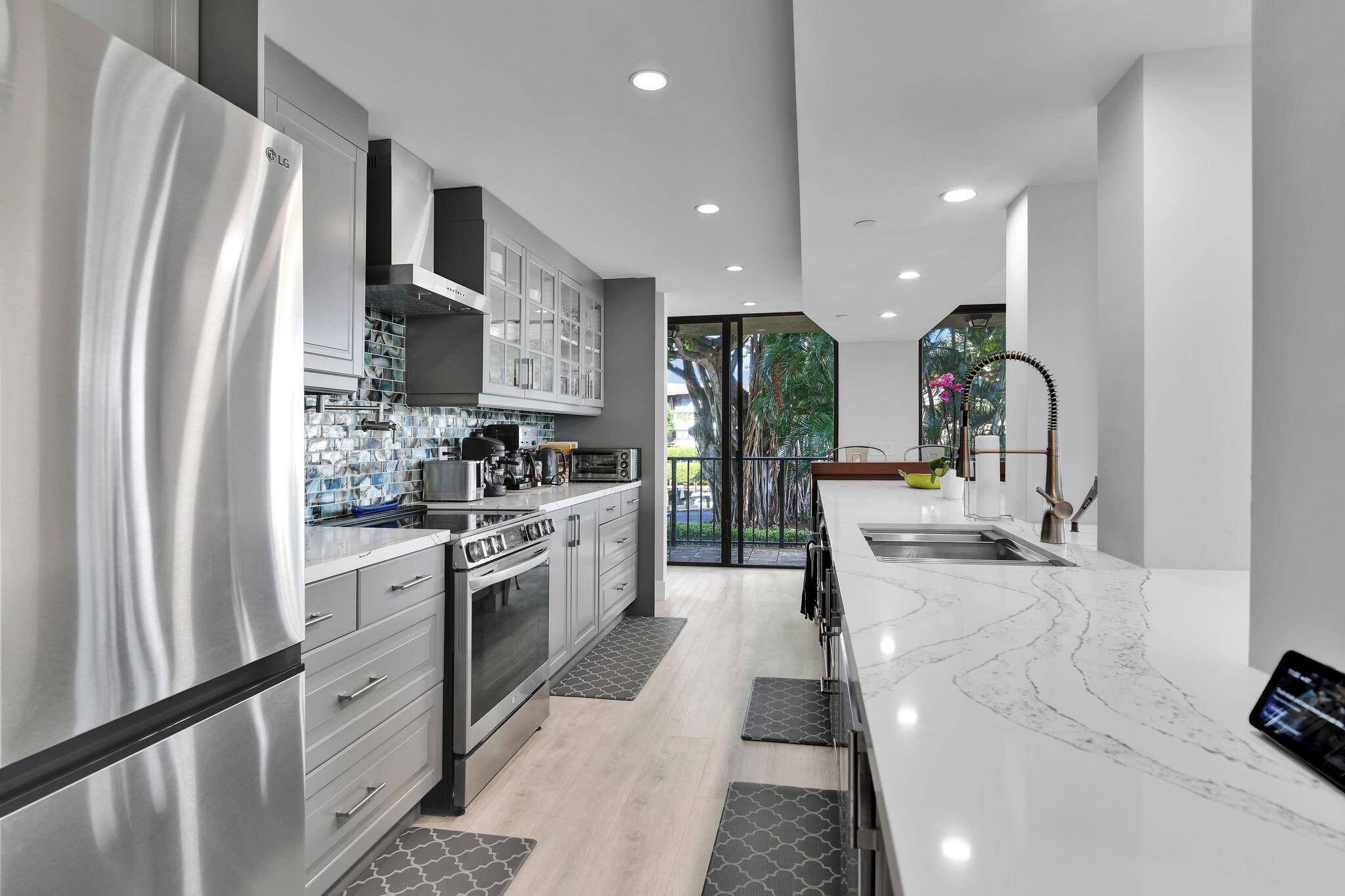 SPECTACULAR, 3BR 2BA North West East Corner Condo in highly sought after NEWLY RENOVATED Porta Bella Yacht and Tennis.