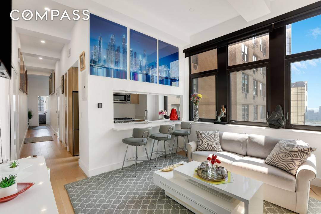 SOHO Living in Midtown. This fully renovated 2 bedroom 1 bath with river views from the living room and windowed kitchen.