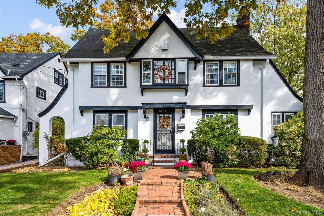 Landmarked Tudor style home for sale in Addisleigh Park, one of Queens' most historic and architecturally rich neighborhoods.
