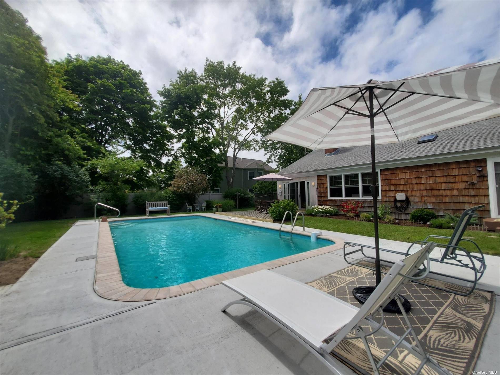 Your Hamptons July vacation awaits at this spacious 3 Bedroom Ranch home with a fabulous in ground pool.