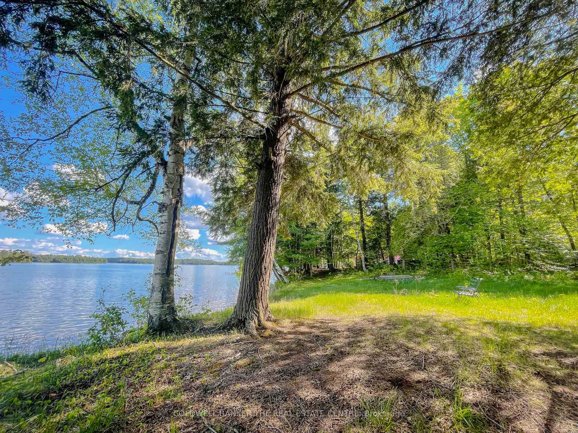Discover the perfect blend of natural beauty and endless possibilities with this exceptional waterfront lot on the pristineshores of Three Mile Lake.