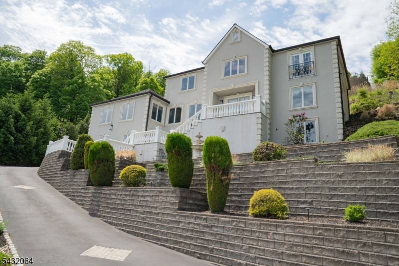 Gorgeous, custom built Colonial that sits at the end of a cul de sac in Cedar Grove's coveted Park Ridge Estate section, capturing breathtaking views and exceptional privacy.
