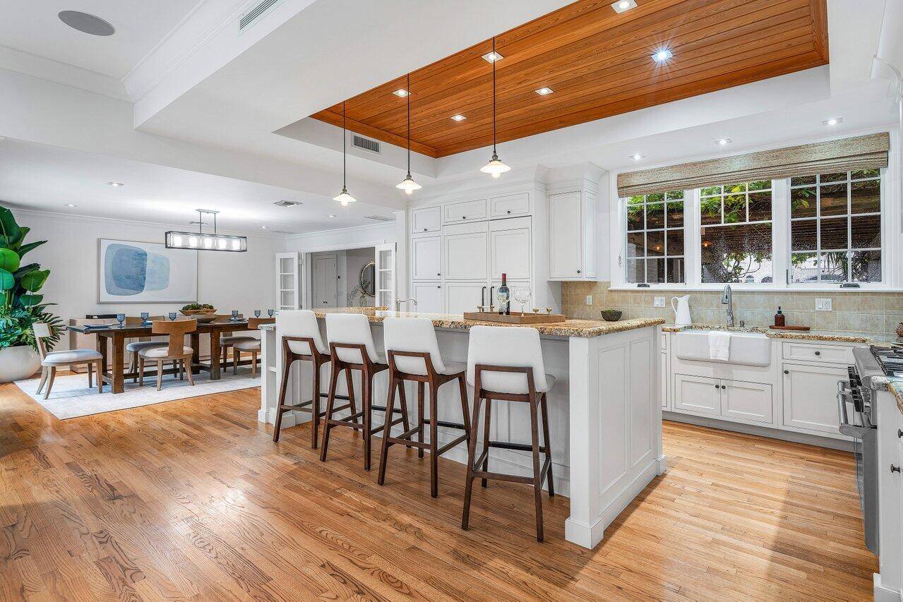Step into a one of a kind residence at 65 Palm Square in the prestigious Delray Beach Marina Historic District, where timeless character and modern luxury converge.
