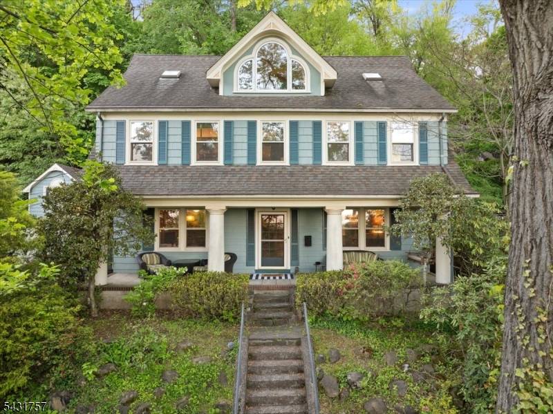 Welcome to this beautifully preserved century old Dutch Colonial in one of Montclair's most picturesque settings.