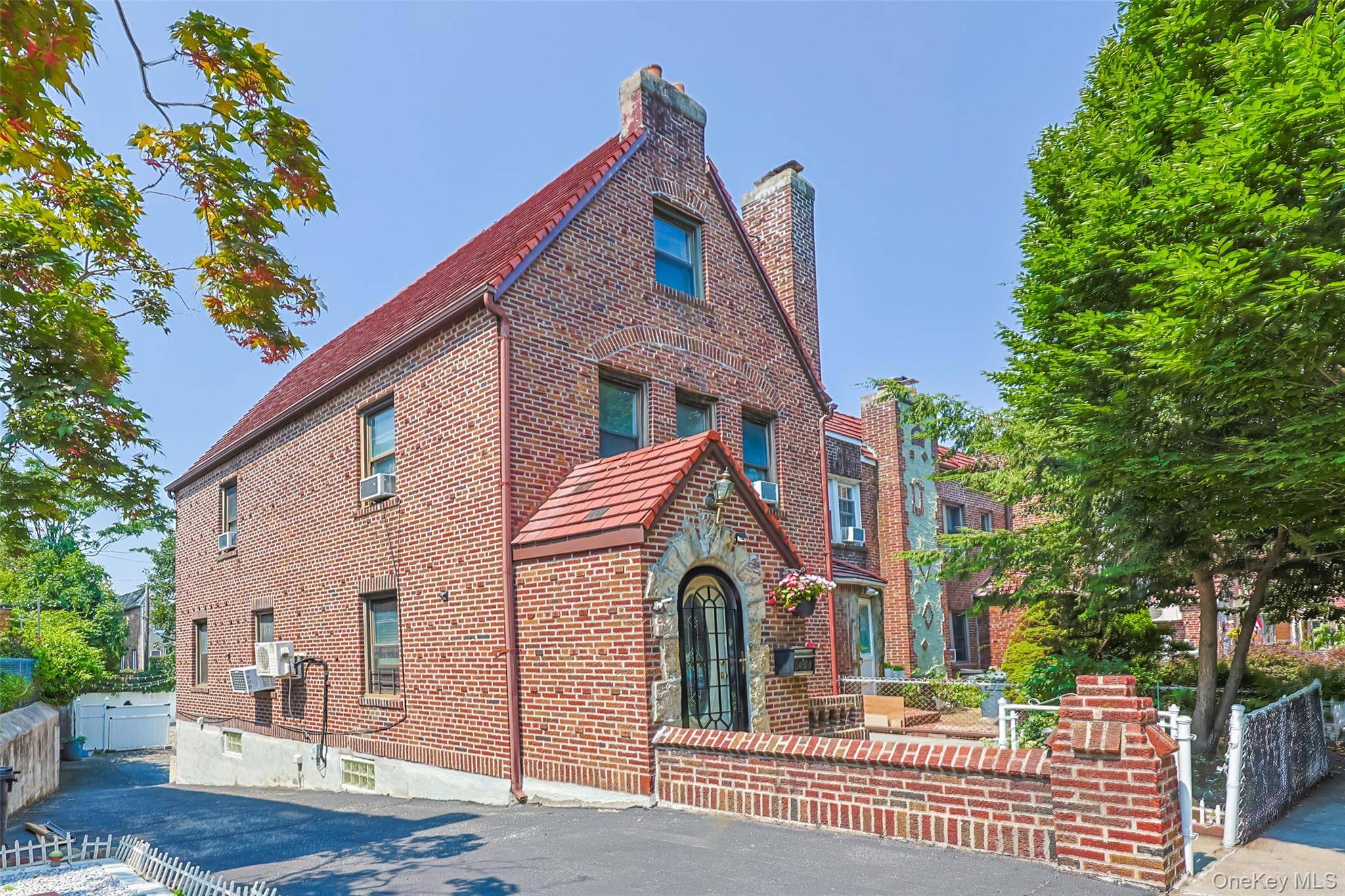 Welcome to this rare semi detached brick Tudor in the heart of Middle Village zoned R4B for 2 family use, currently configured as a spacious single family home.