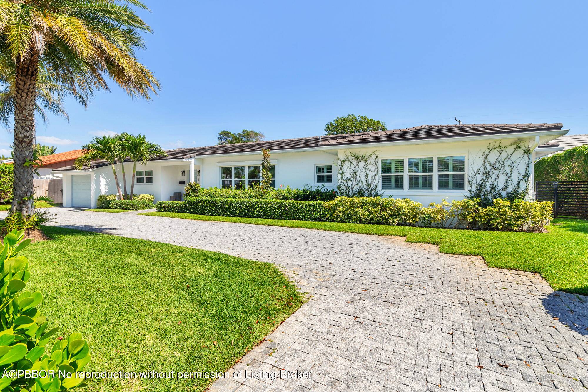 Nestled in the sought after SoSo neighborhood of West Palm Beach, this 3 bedroom 3 bathroom home, renovated by Caroline Rafferty Interiors, offers a spacious layout.