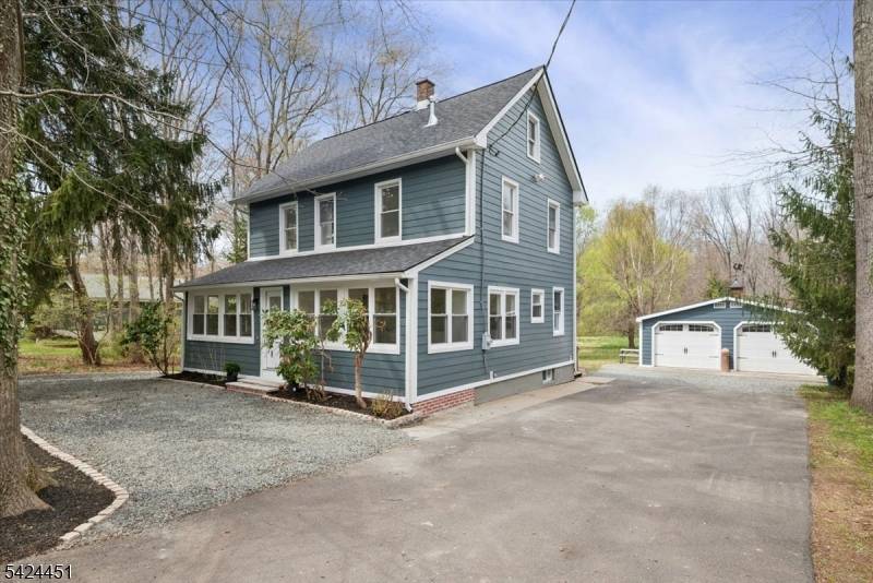 Set on a picturesque 2. 32 acre property in the desirable Gillette section of Long Hill Township, this beautifully revived circa 1900 Colonial blends timeless charm with modern luxury.