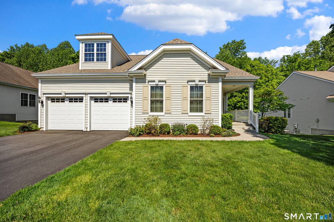 Desirable Redbridge model in Cheshire Crossing set on a premium lot with wooded rear exposure !