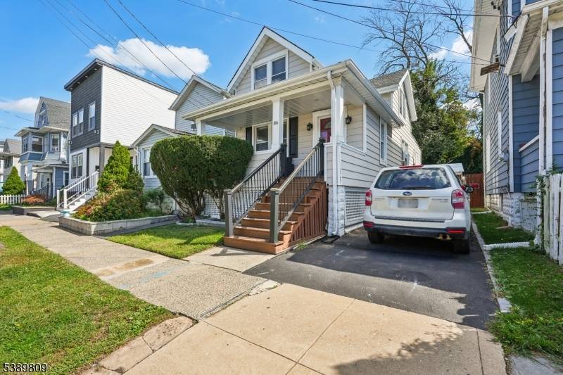 Move In Ready Charming Cape Cod with detached Garage Driveway.