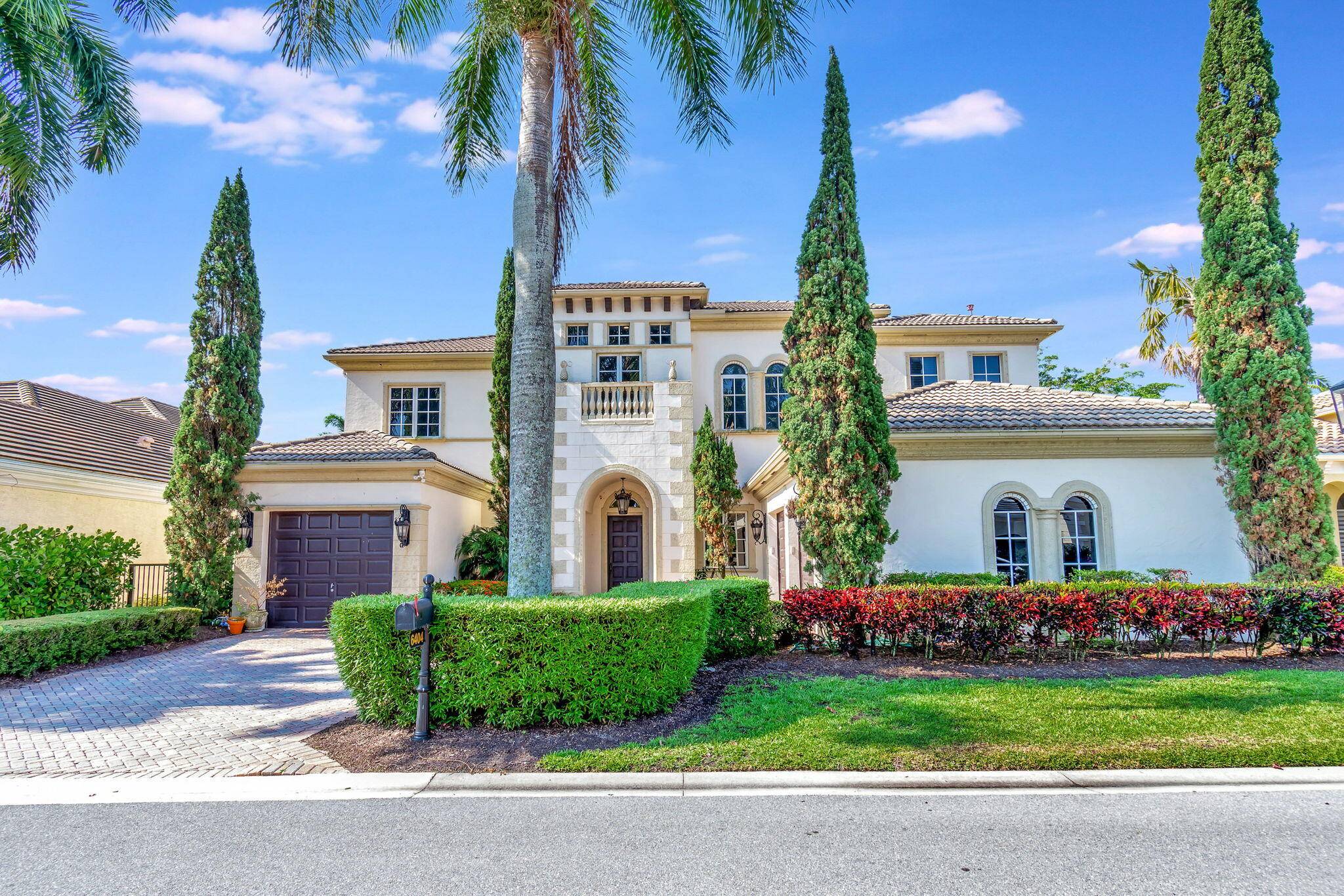 An exquisite Tuscan estate nestled in the heart of Mizner's Preserve offers the elegance of tradition and the ease of contemporary living.