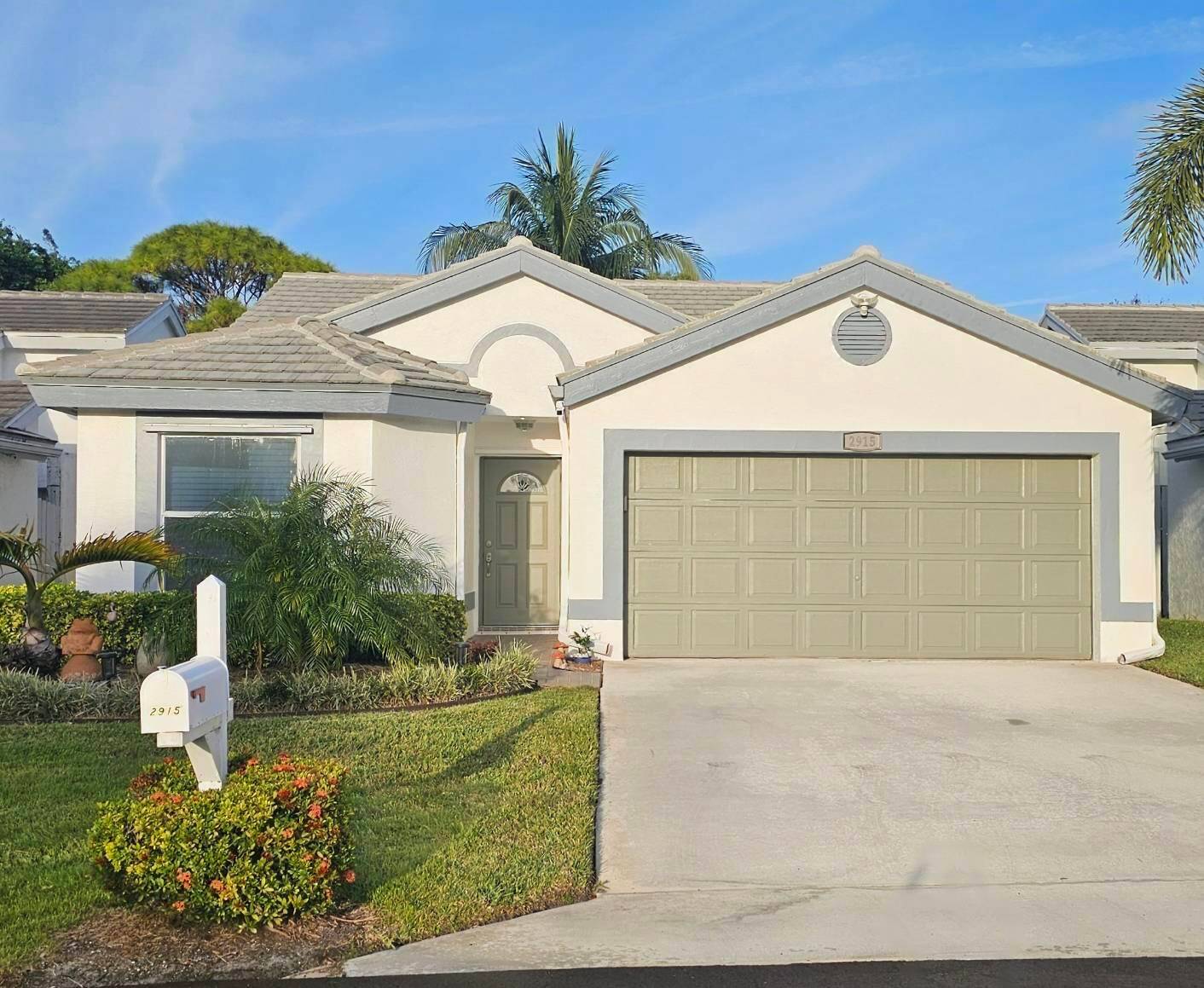 This spacious 2 2 offers a serene lake view, a screened lanai and a two car garage.