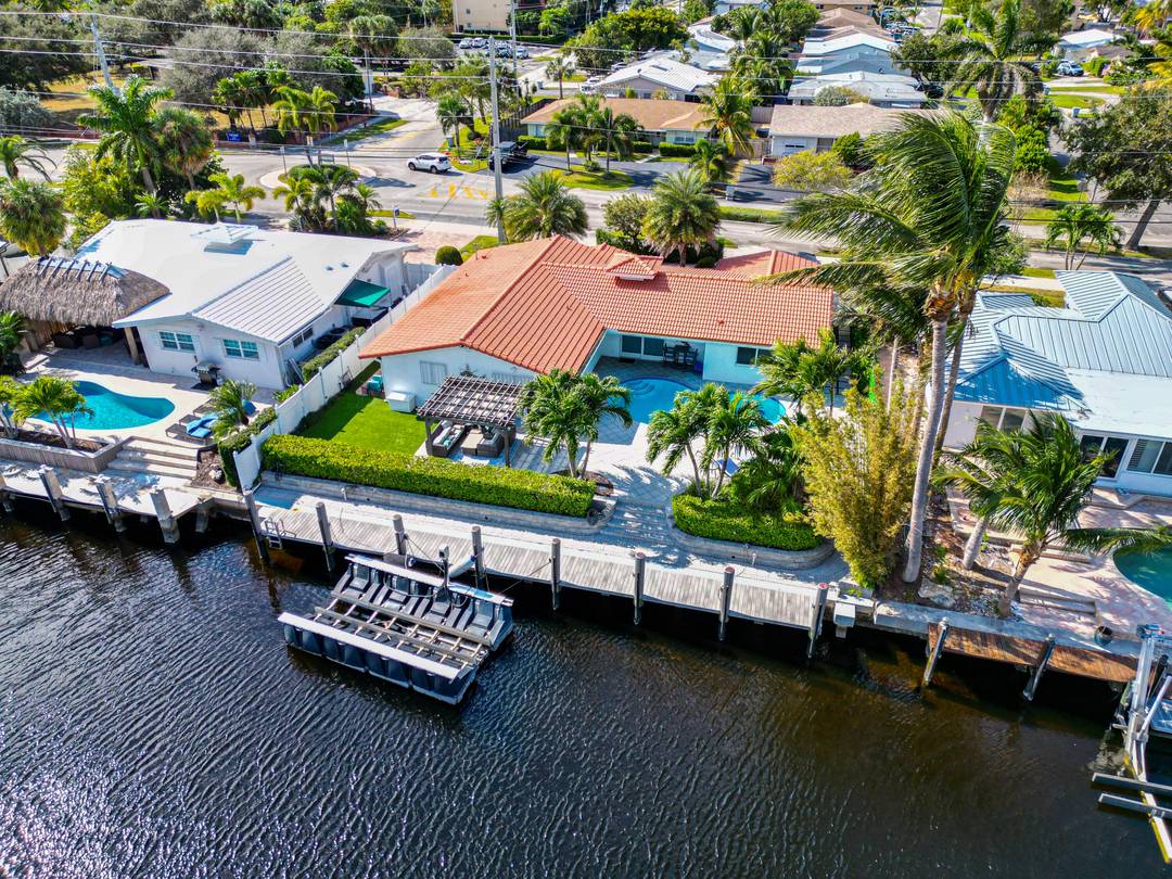 Envision a serene retreat nestled on 80 ft of waterfront with excellent boat dockage and No fixed bridges which offers unobstructed access to the open sea.