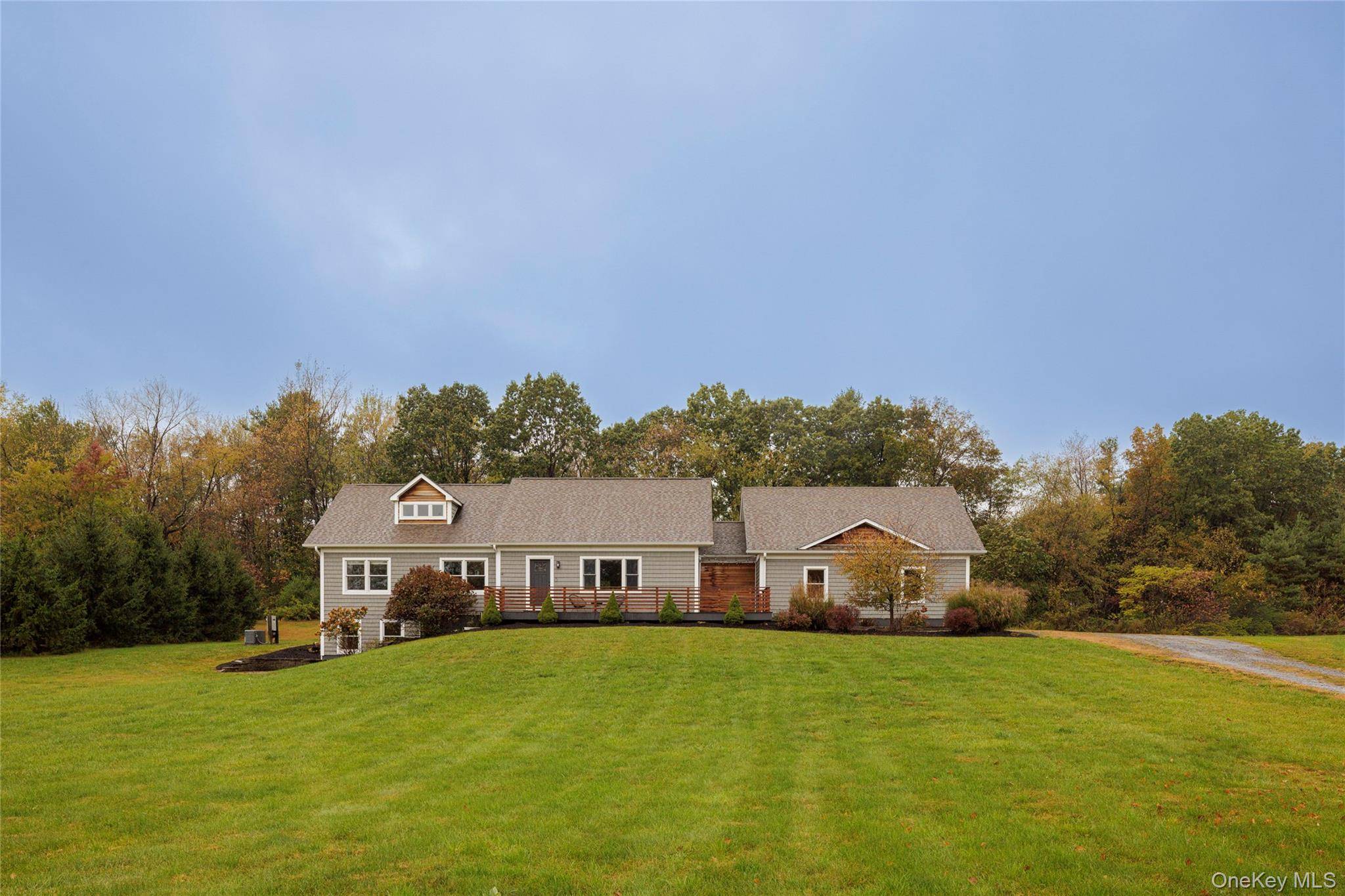 Nestled down a private road, this spacious home has designer updates for a turn key experience.