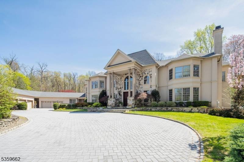 Spectacular custom estate in one of Warren's most desirable neighborhoods, offering resort style living with pool, tennis court, and updated patio surround.