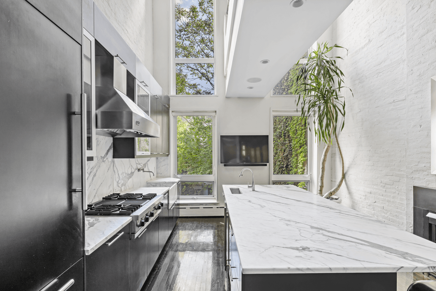 In the heart of Chelsea's vibrant gallery district, where the High Line meets the iconic Hotel Chelsea, an extraordinary townhouse opportunity emerges.