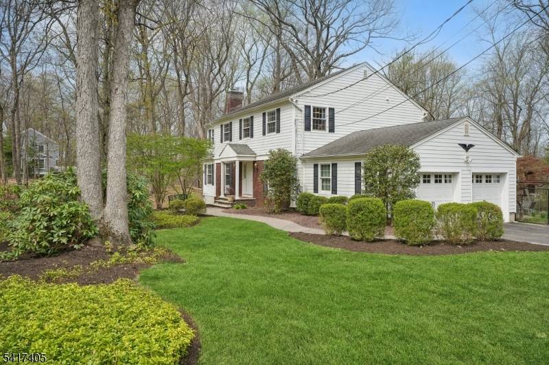 Tucked away in one of Watchung's most sought after neighborhoods, this classic Colonial sits gracefully on a picturesque 1.