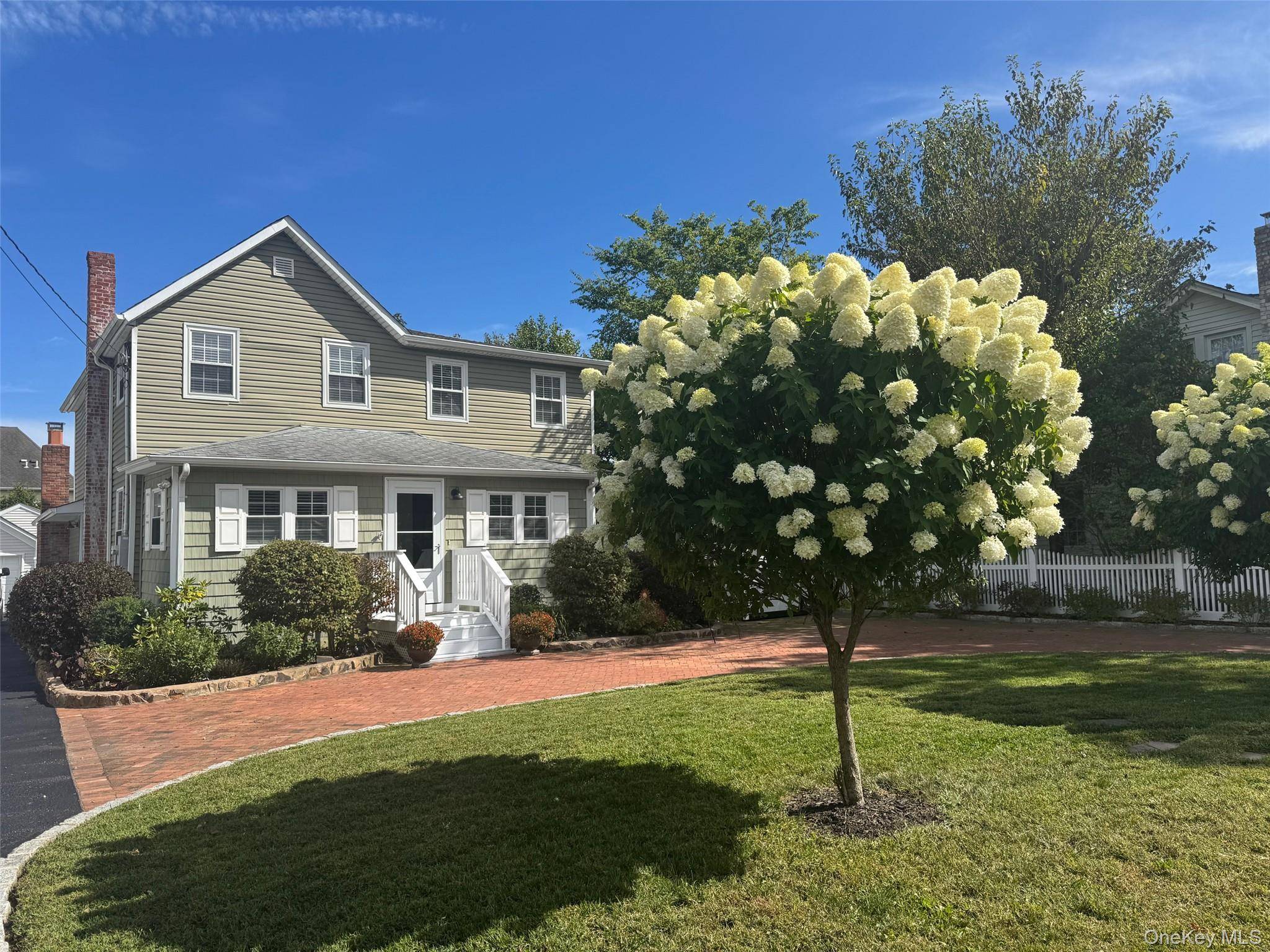 Welcome home to this recently renovated charming colonial, perfectly situated on a quiet street just moments from vibrant downtown Patchogue Village.