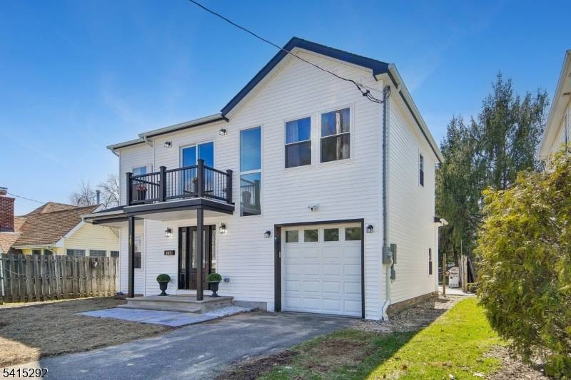 Completely rebuilt on an expanded foundation, this like new home offers modern construction, clean design, and turnkey living.