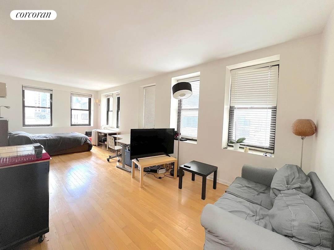 Sun Drenched Corner Studio with Historic Charm Welcome to Apartment 15B at 56 Pine Street a beautifully appointed corner studio offering an abundance of natural light and classic New York ...