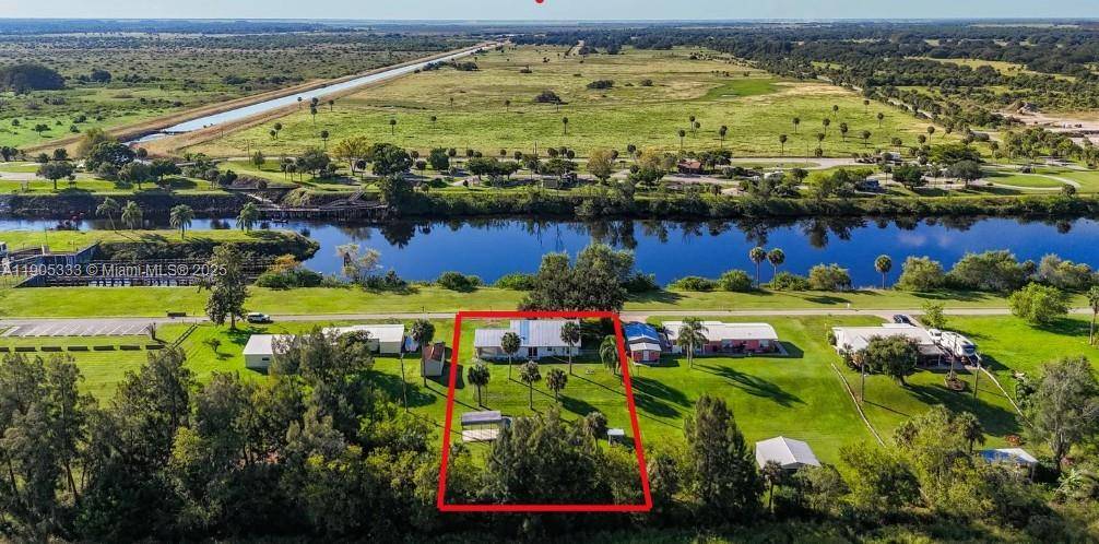 AFFORDABLE RIVERFRONT CHARMER RETREAT OR RETIRE !