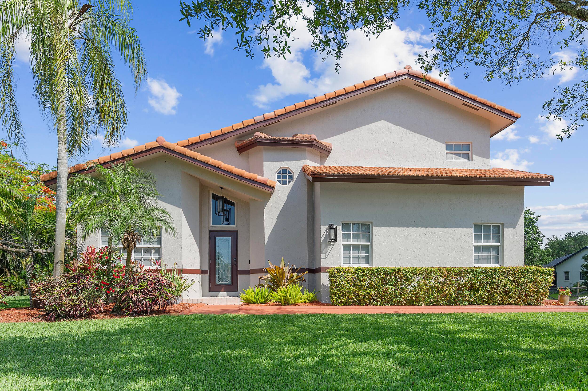 Nestled in The Trails in a quiet cul de sac on an expansive 0.