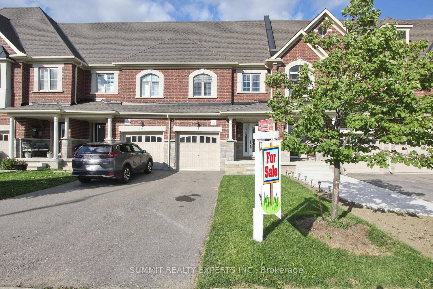 Beautiful townhouse in a desirable location featuring an upgraded kitchen with quartz counter tops, matching backsplash stainless steel appliances, and modern cabinetry.