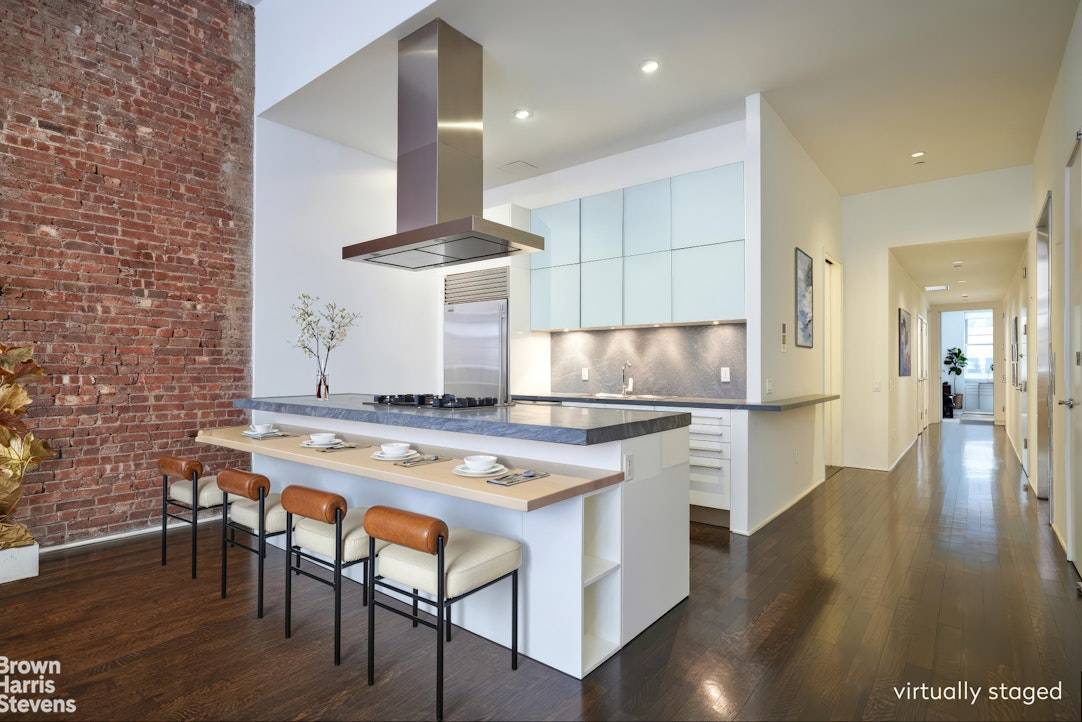Enjoy soaring 13 ceilings in this 1, 742sqft 2 bedroom, 2 bath Condo loft on one of SoHo's premiere cobblestone streets.
