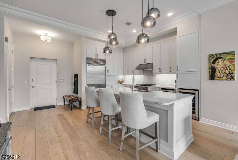 Welcome to this rare, two story townhouse at The Glass House in Edgewater !