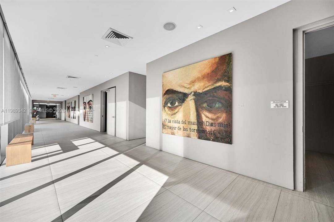 Stunning corner residence in Edgewater with breathtaking, unobstructed Biscayne Bay and skyline views from every room.