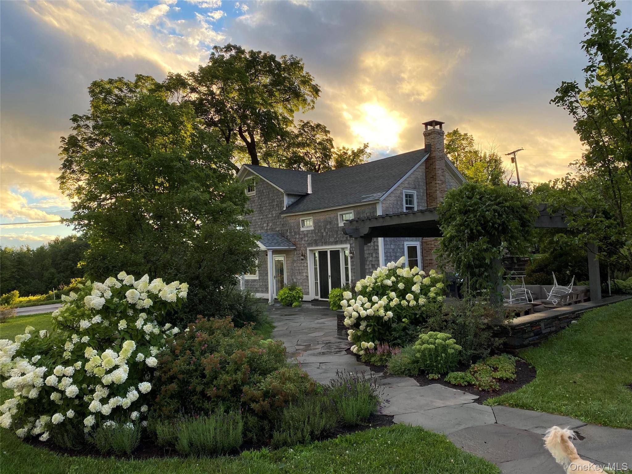 Charming farmhouse, built in 1860, thoughtfully modernized for comfortable indoor outdoor living.