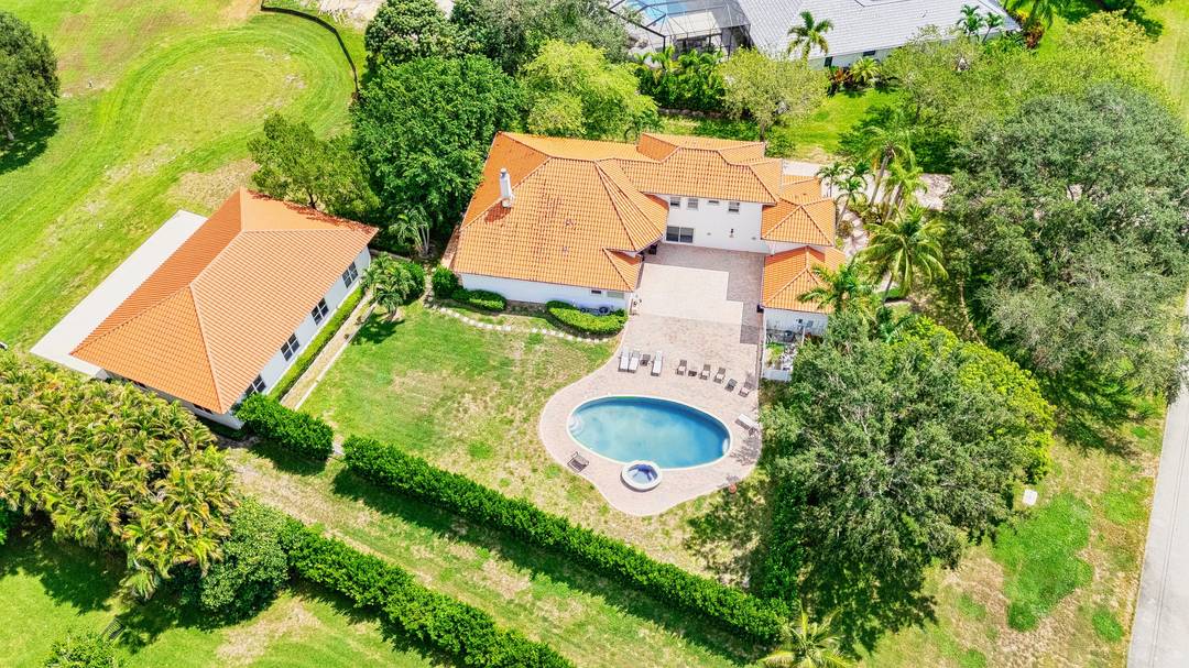 A rare aviation ready estate in Wellington's exclusive Aero Club, this distinguished Mediterranean style home spans 3, 522 sq ft across a 1 acre, beautifully landscaped lot.